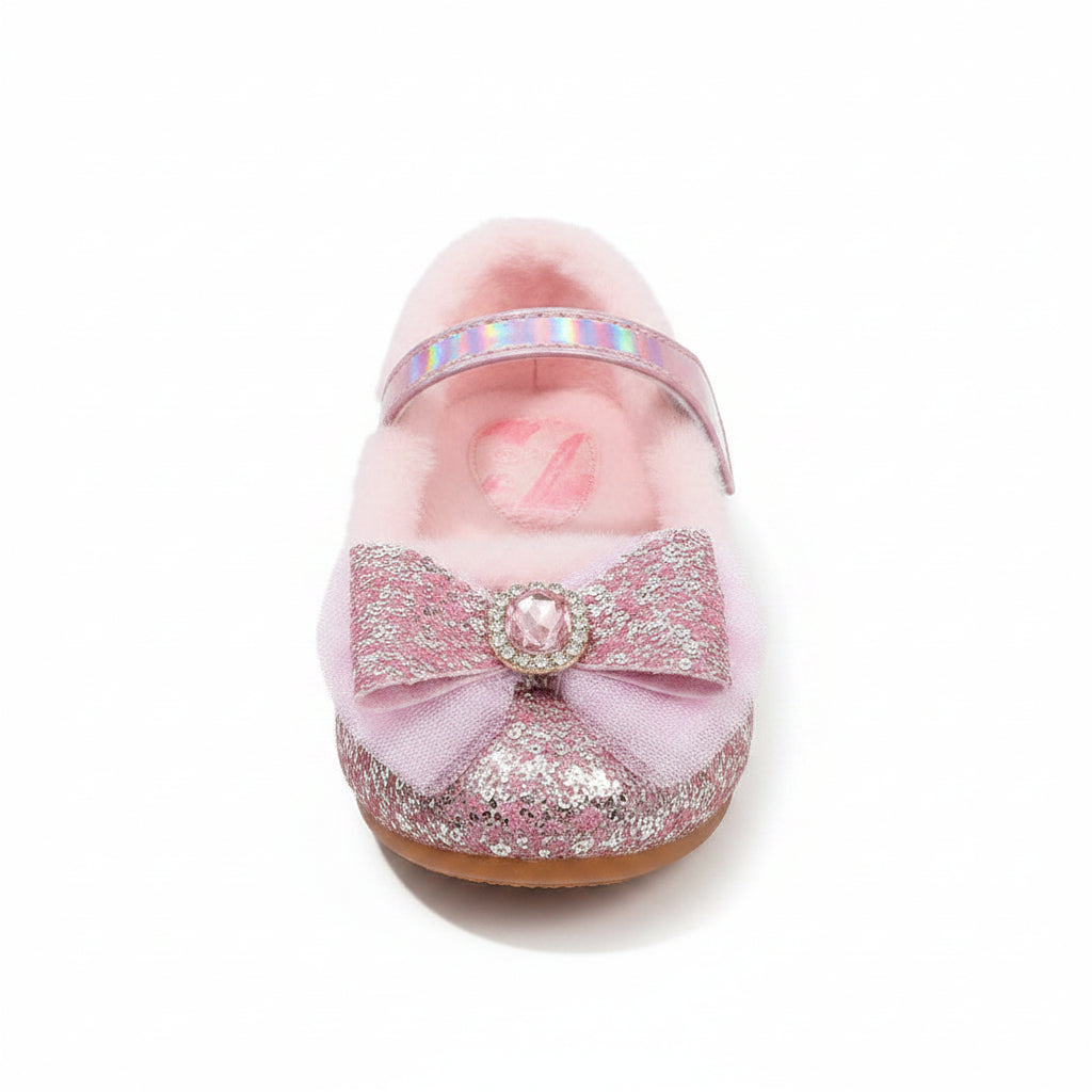 Pink fuzzy slippers with glittery bows on a fluffy white surface
