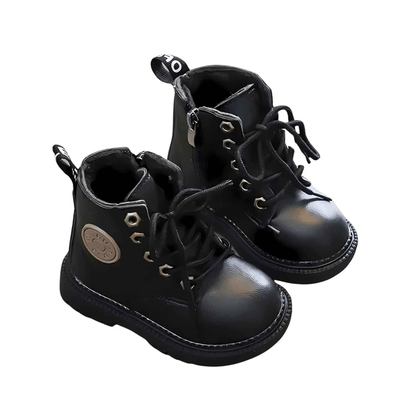 Black bear kids winter boots, side profile showing sole and upper detail
