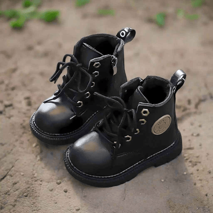 Black bear kids winter boots, close-up of design detail and material